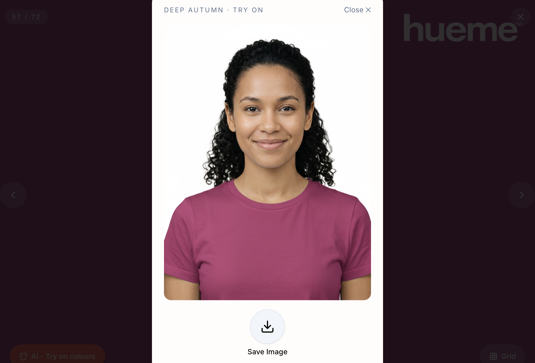 Woman holding her phone with an AI try-on in coral